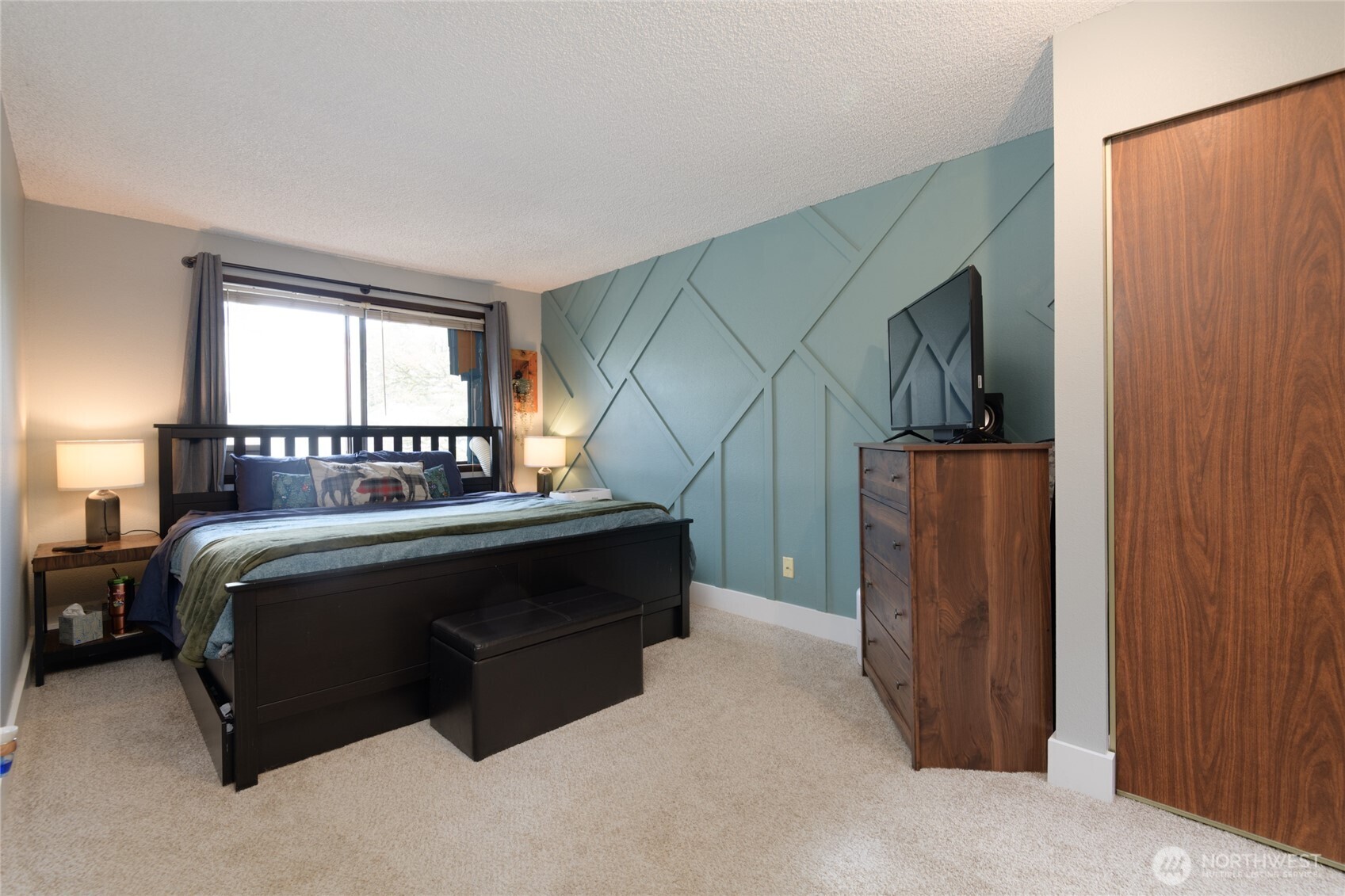 Skylights fill the upstairs with natural light, enhancing the ambiance of both spacious bedrooms, the full bathroom, and the conveniently located laundry room.