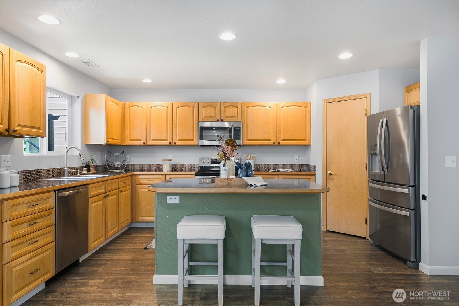 Beautiful french doors lead to patio and fully fenced back yard.