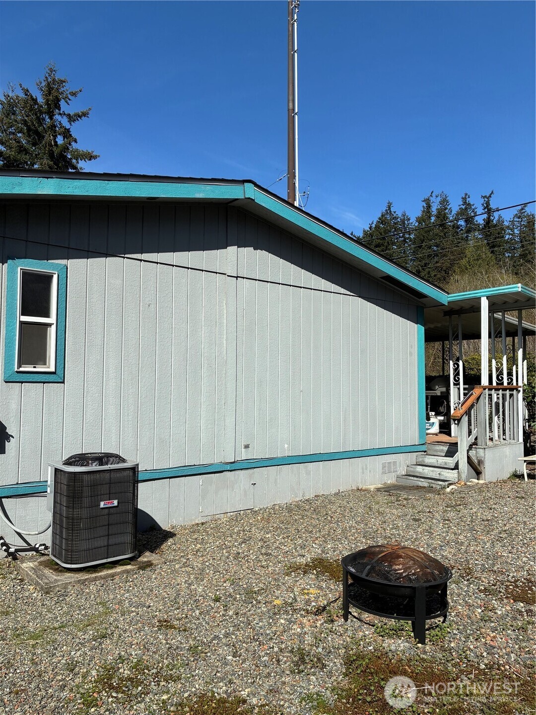 Side with Heat Pump and Fire Pit