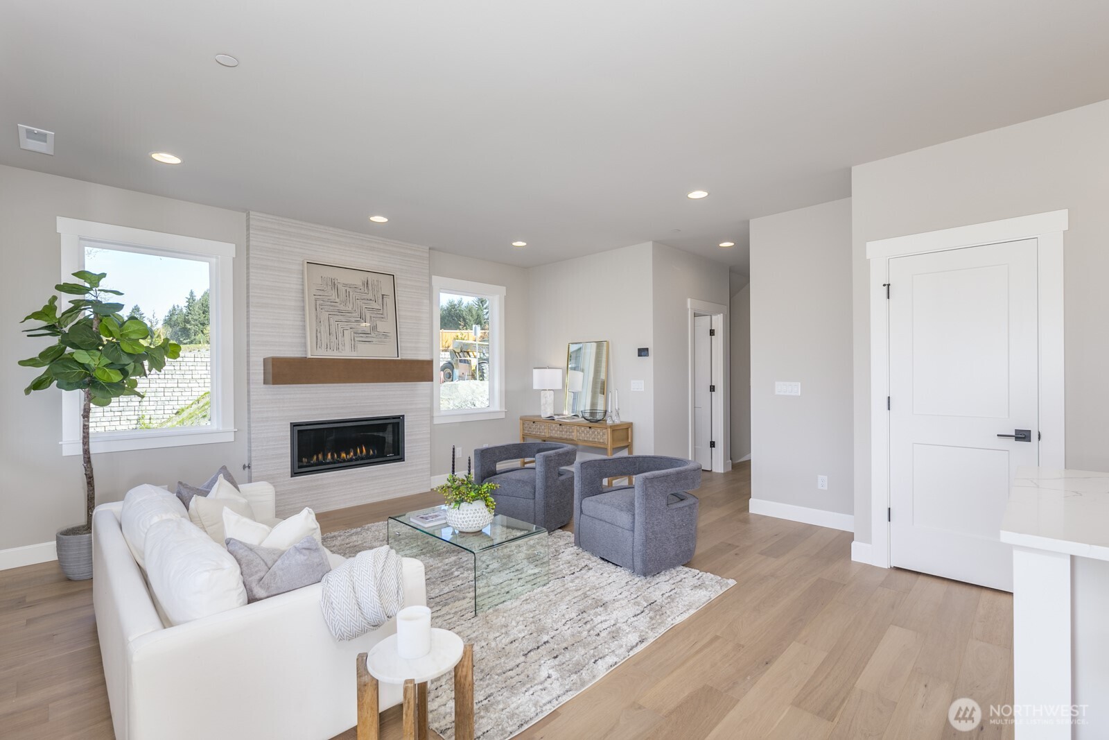 Spacious gourmet kitchen with illuminated custom cabinets