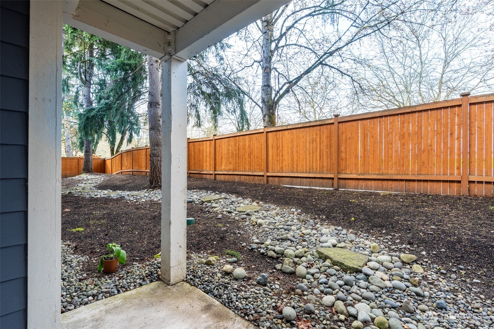 Privacy with tree lined backdrop.