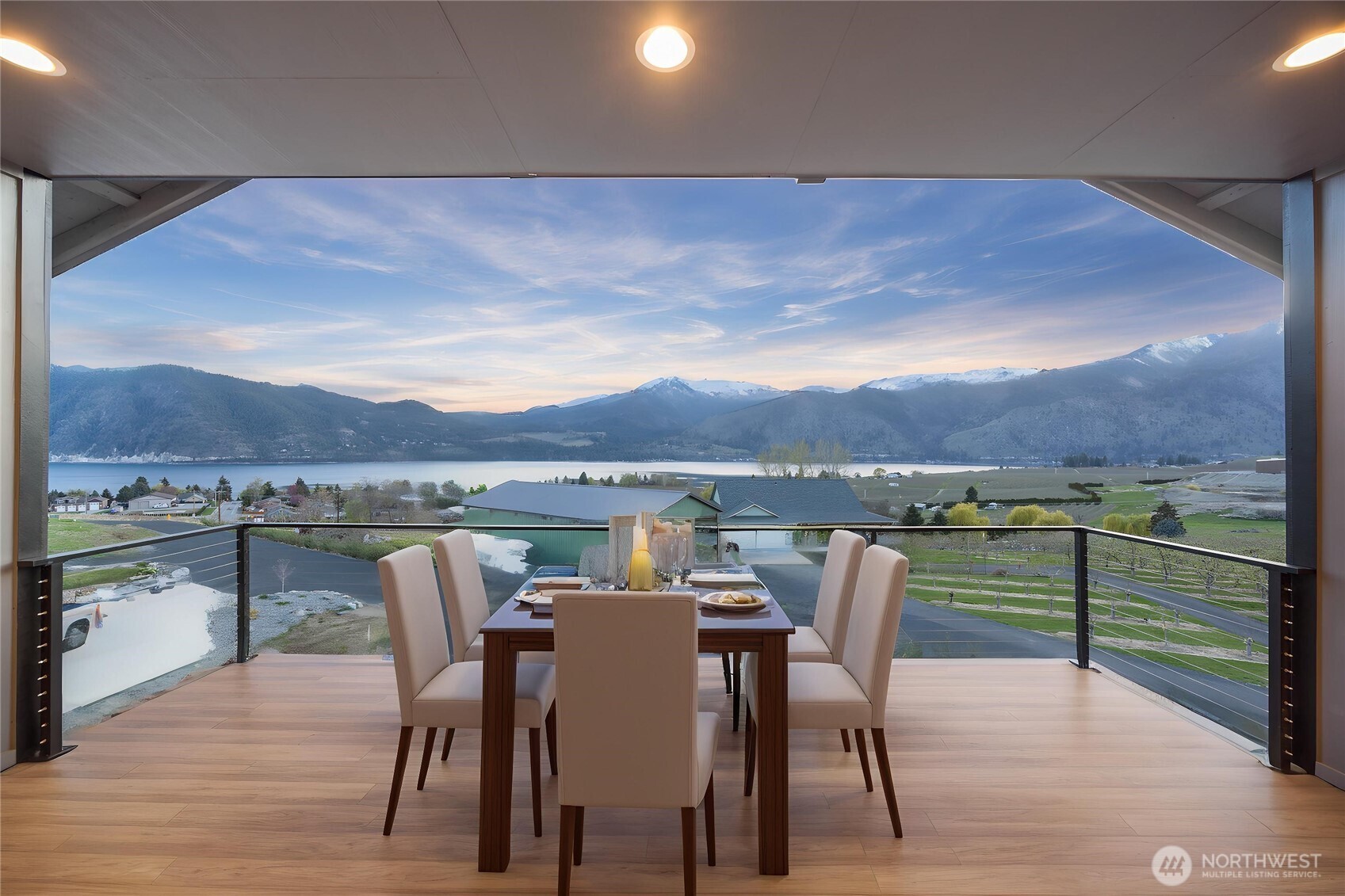 Deck off the livingroom/kitchen. Digitally staged.