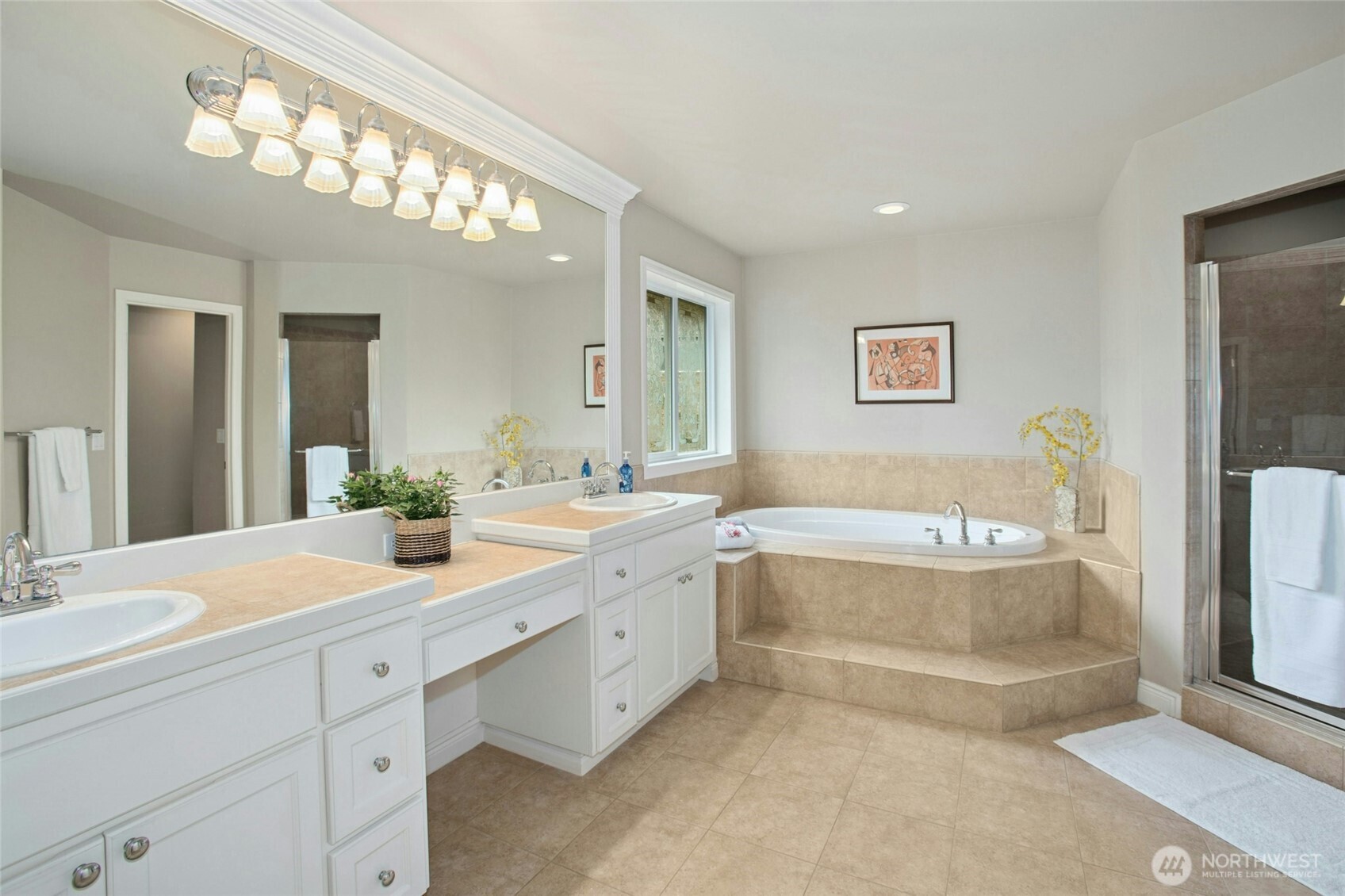 Five piece primary bath with soaking tub and shower.