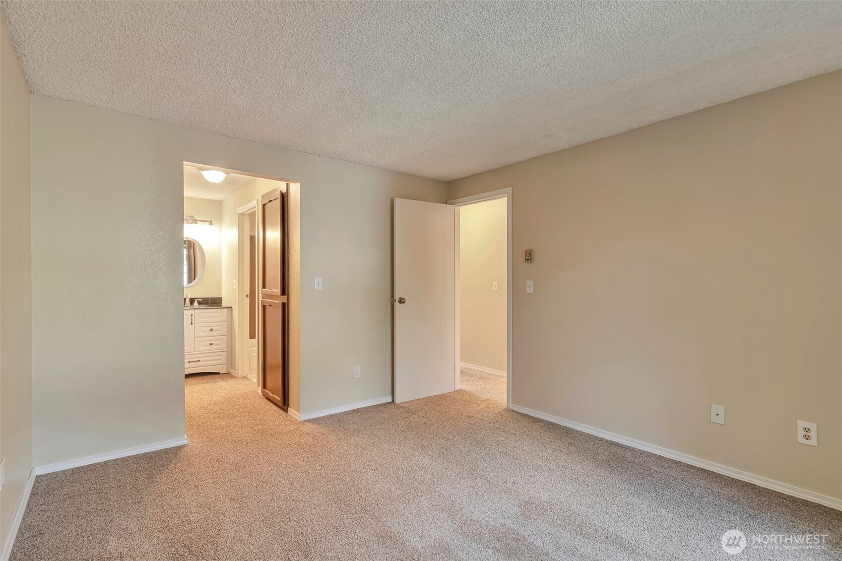 The primary bedroom is easily big enough for any-size bed and is shaded by mature landscaping, making this room a quiet and calming retreat. And extra storage allows you to bring it all with you!