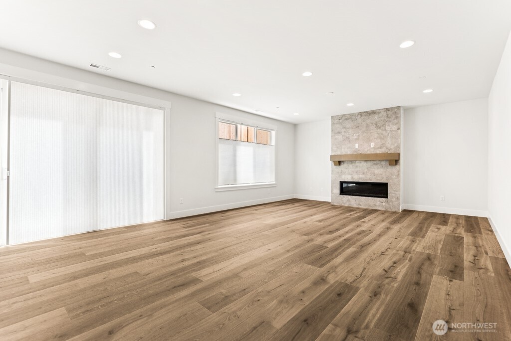Open concept living! Cozy gas fireplace with full height tile
