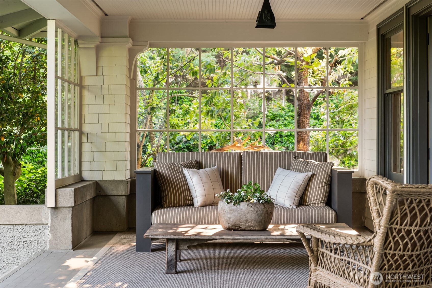 The front porch opens wide to the formal living room where  a frame television is equally at home with sports as it is with powerpoint presentations.