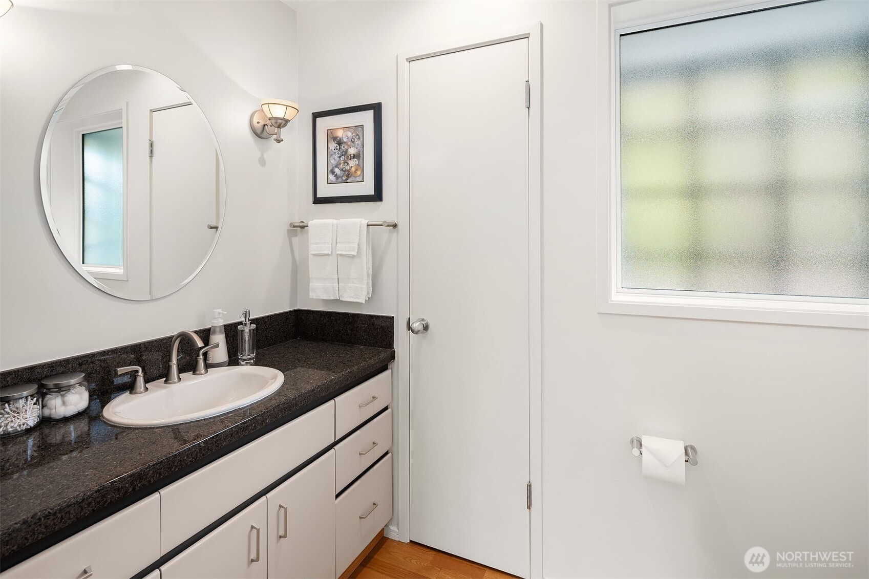 A downstairs powder room, ideally located for easy access and perfect for hosting guests.