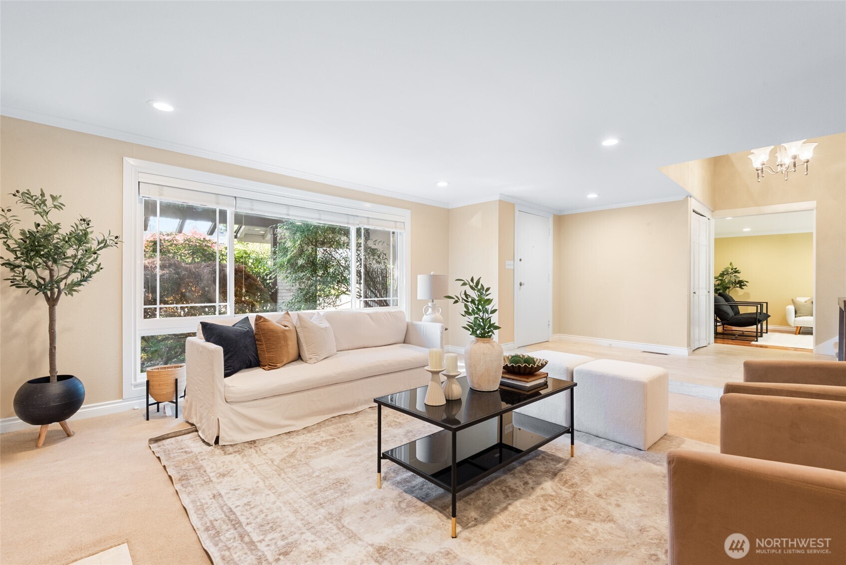 View of the lounge area with front door in back ground