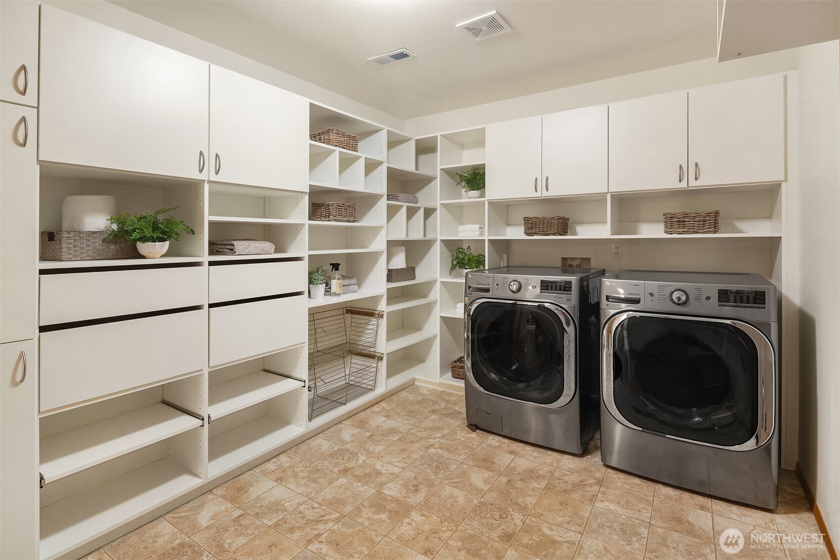 HUGE Laundry Room/Mud Room on the Main Level, plenty of room for Costco supplies! Washer, Dryer and Garage refrigerator stay with the home.