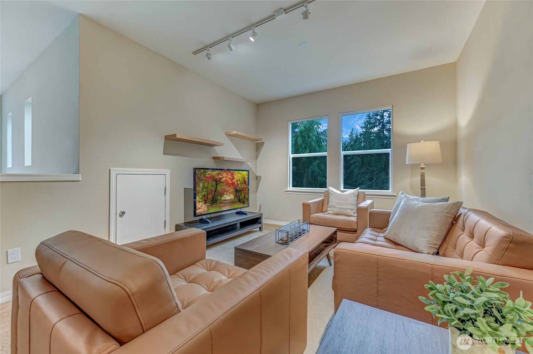 Upstairs is a flexible space for a TV area, office, crafts - whatever works for you!