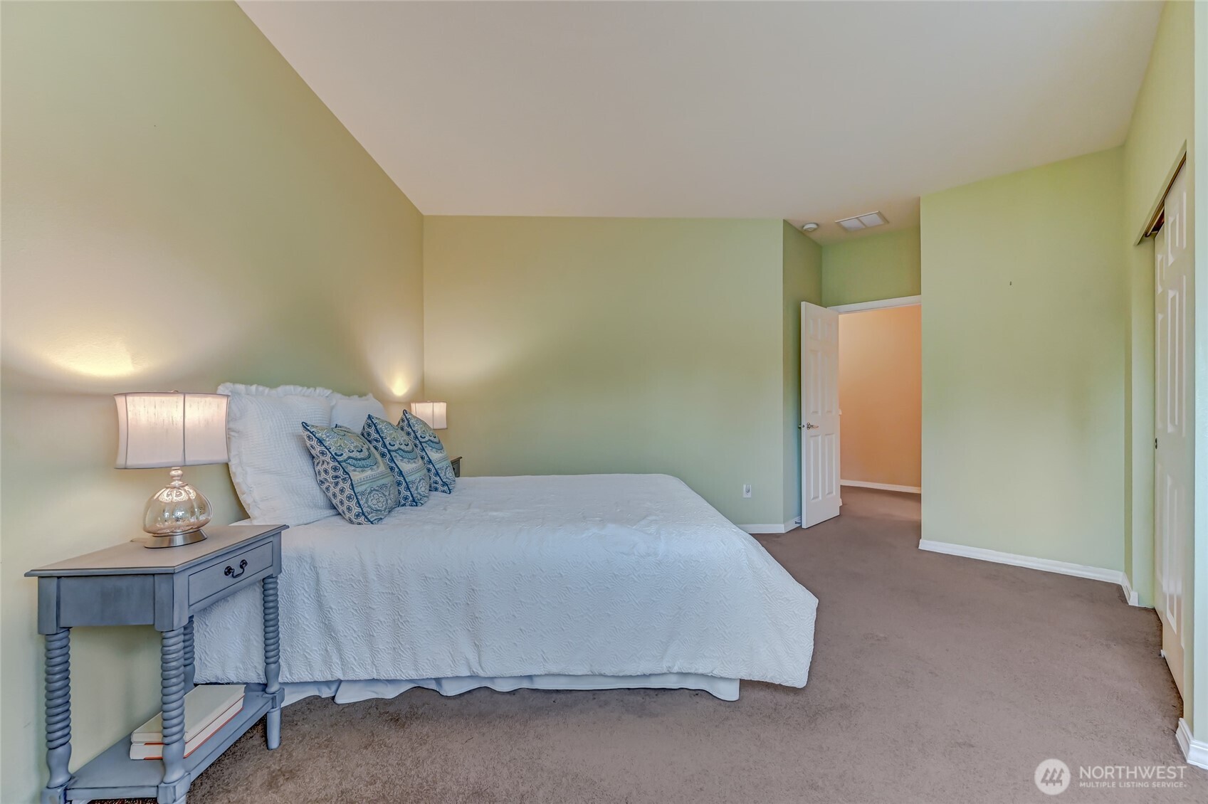 Also upstairs is the second bedroom with an adjacent full bath. This room has amazing natural light!
