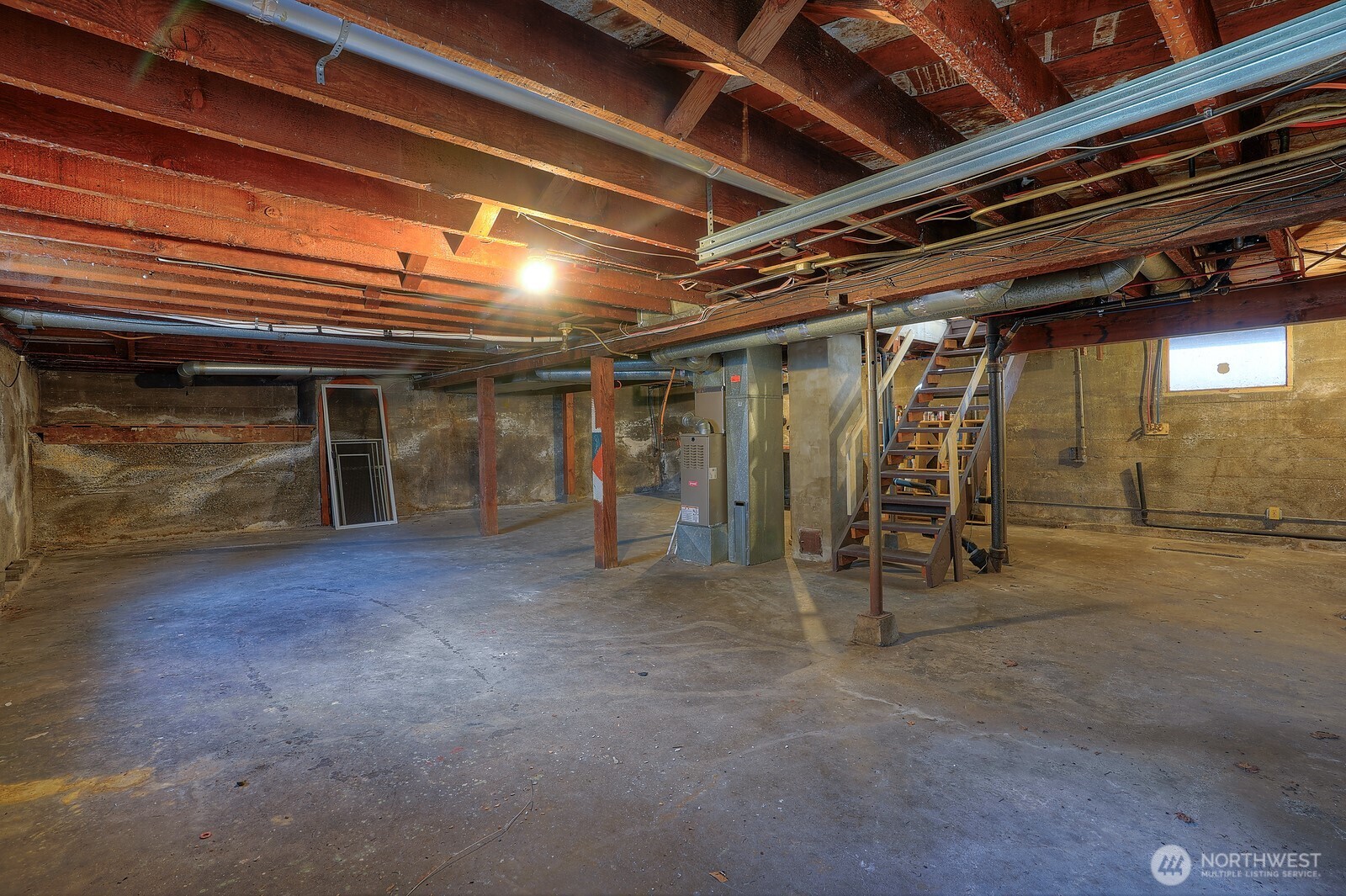 Down in the basement, we can see some of the sturdy construction of days gone by.  Want even more living space?  The headroom down here is high- finish this area and even giants will feel at home.