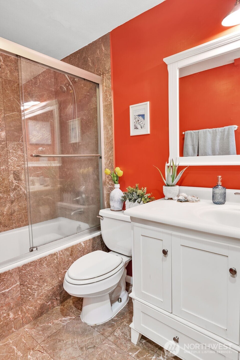 This photo shows the large/deep jetted tub and luxurious marble and glass surround!