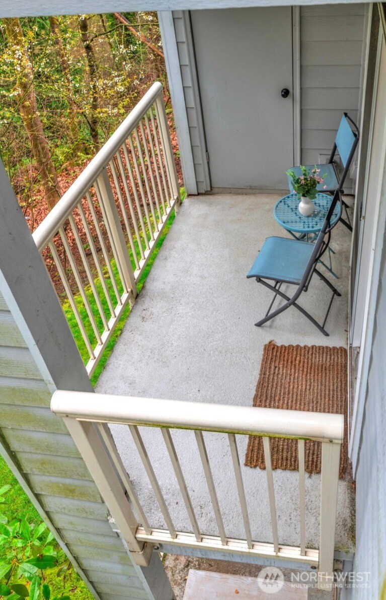 Enjoy your morning coffee and enjoy the privacy and nature of the adjacent greenbelt on your own private deck. The door shown is an additional storage closet.