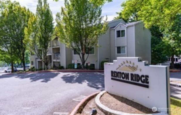 There are two entrances to Renton Ridge off Aberdeen Ave NE. The Northern-most entrance has this sign. The community center, pool, and hot tub are to the left of this. Building F is past the community center Westbound, just past the BBall court and BBQ area.