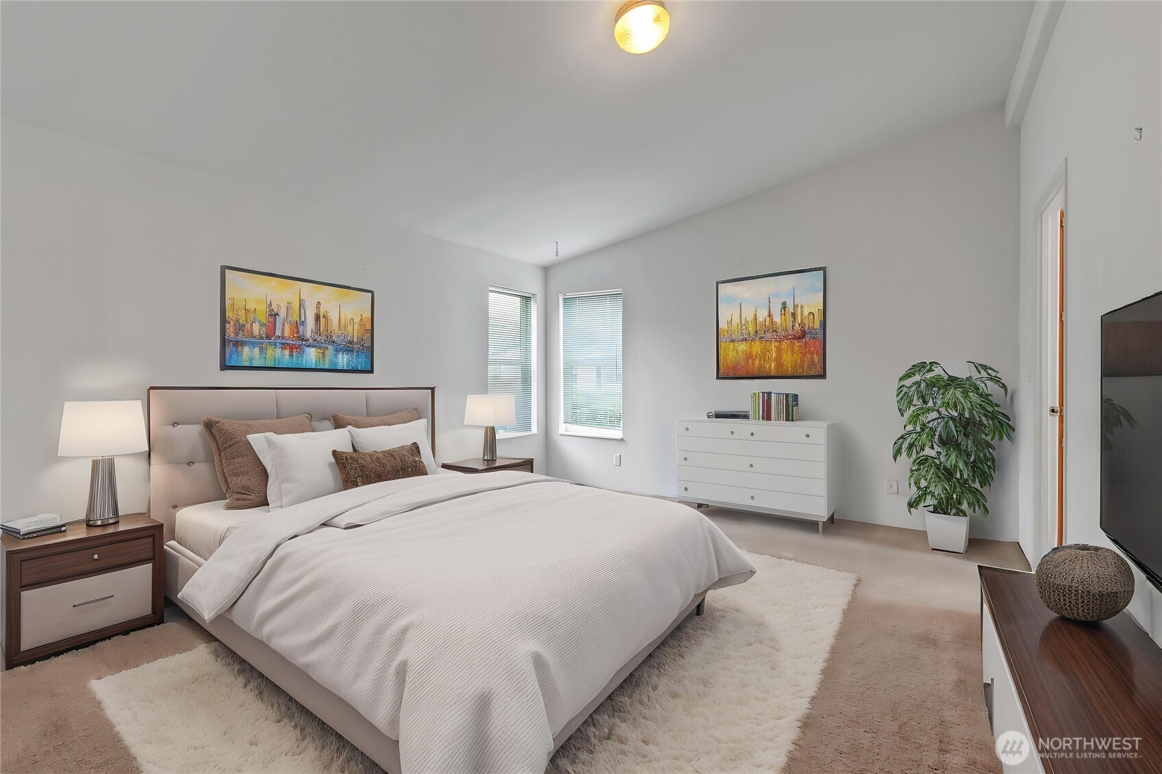 Primary suite is good size and includes a walk-in closet and large bath. This has been virtually staged here for your enjoyment.