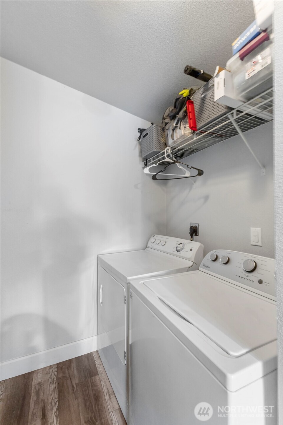 Private laundry room with storage