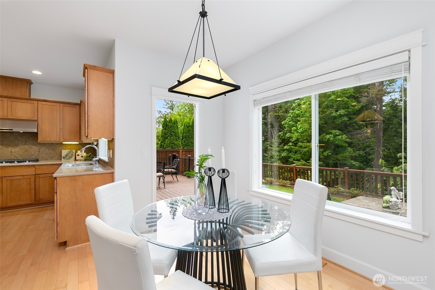 Gourmet kitchen with quartz countertops, center island, undercabinet lighting, and BRAND NEW Samsung gas cooktop & vent hood.