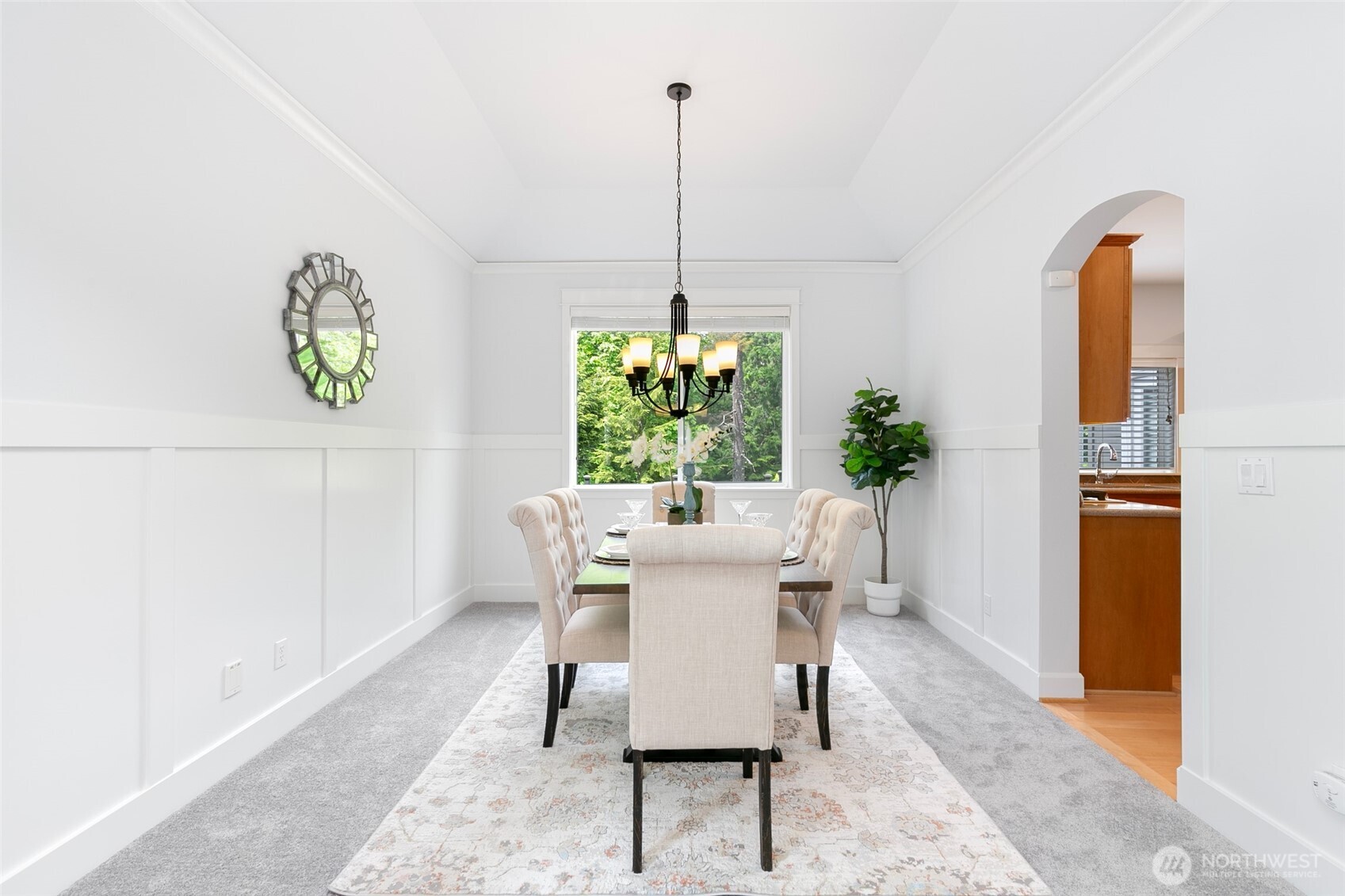 Elegant wainscoting flows from office to formal living & dining.