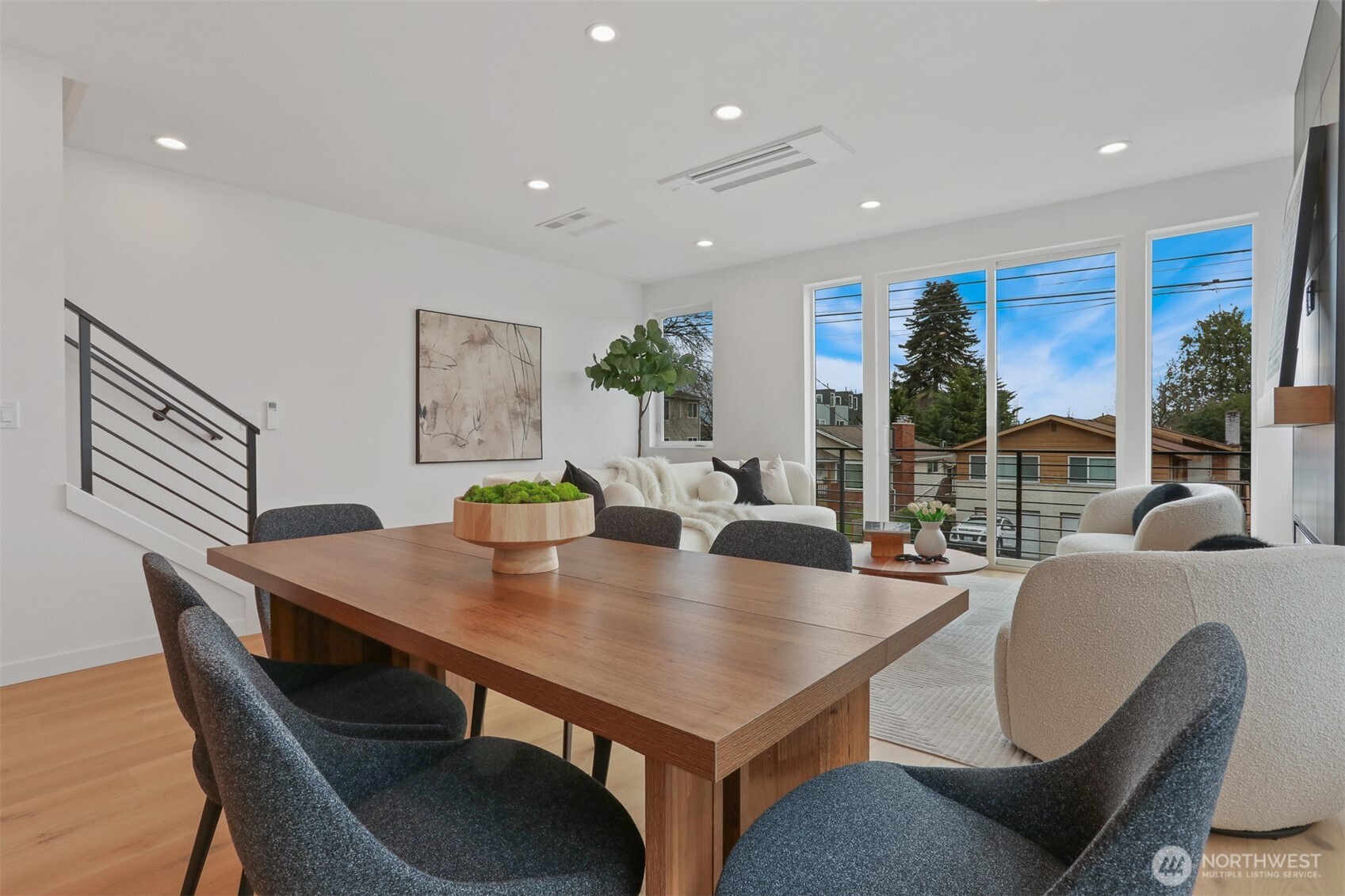 Built-In Heating/Cooling and Partially Open Staircase with Custom Metal Railing