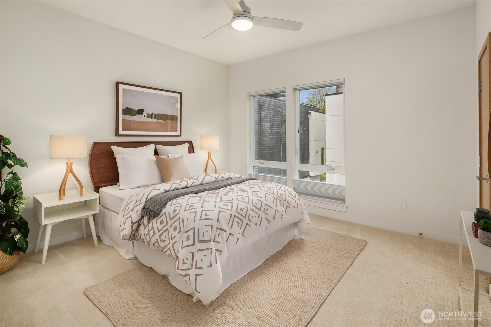 The 2nd bedroom, located on the upper level is roomy & sunny.