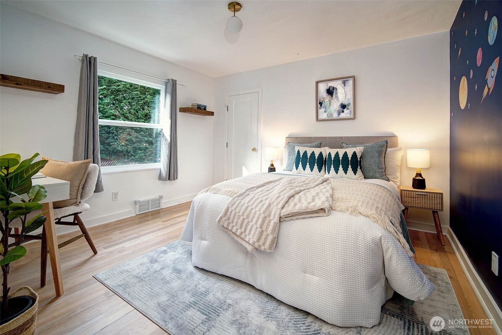The second main level bedroom, also with refinished hardwood flooring.