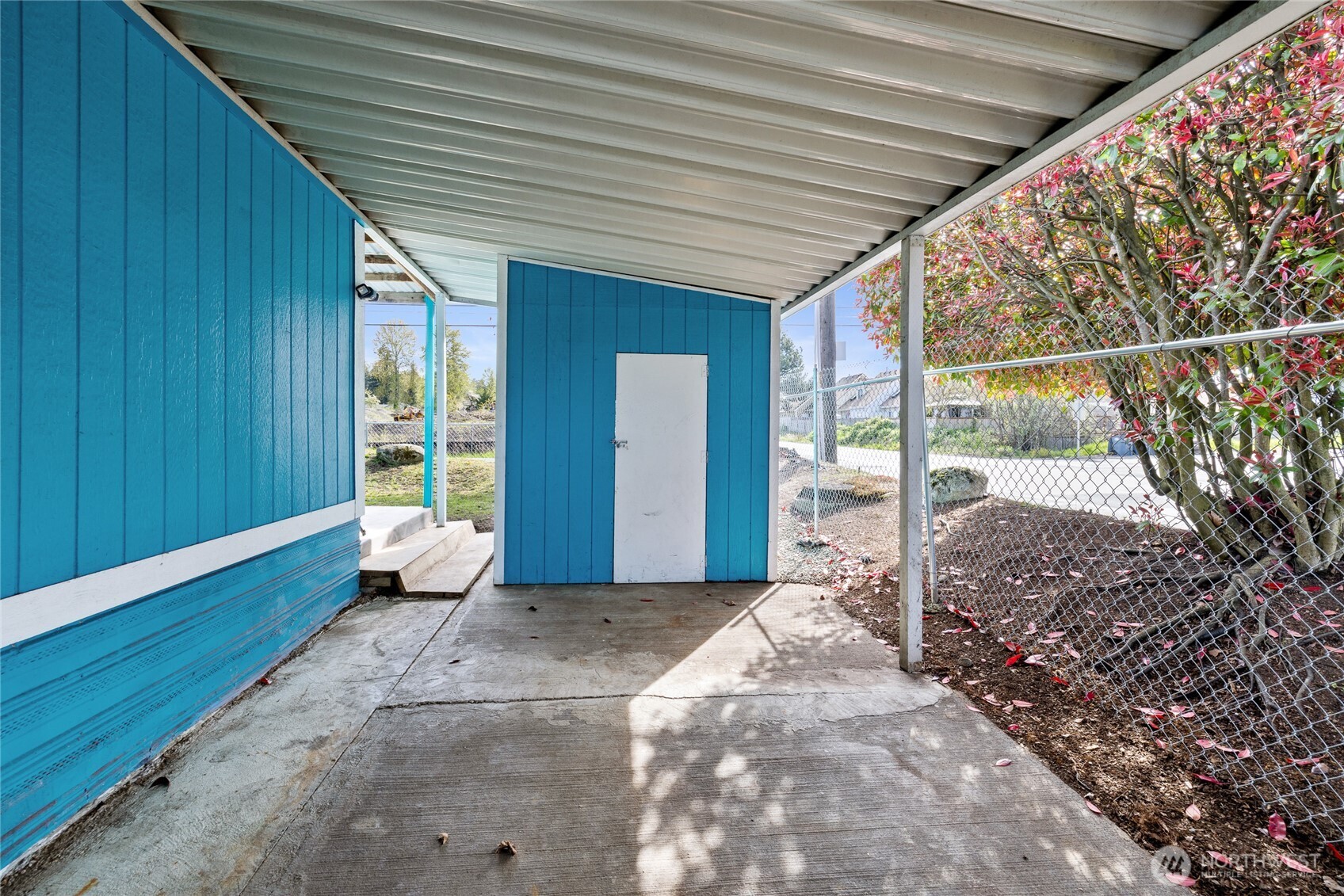 Car port with swing gate for security and privacy.