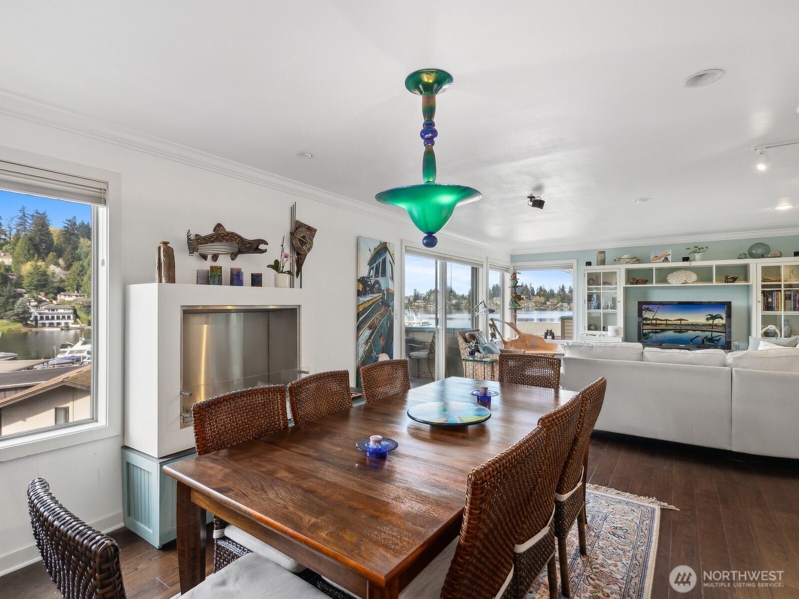 Dining area with Fireplace & wall of view windows.