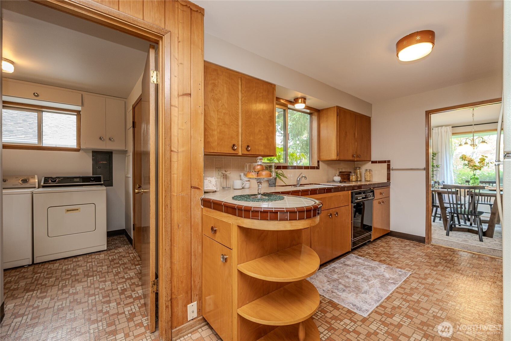 This photo shows the layout of the Kitchen and proximity to the Laundry Room.