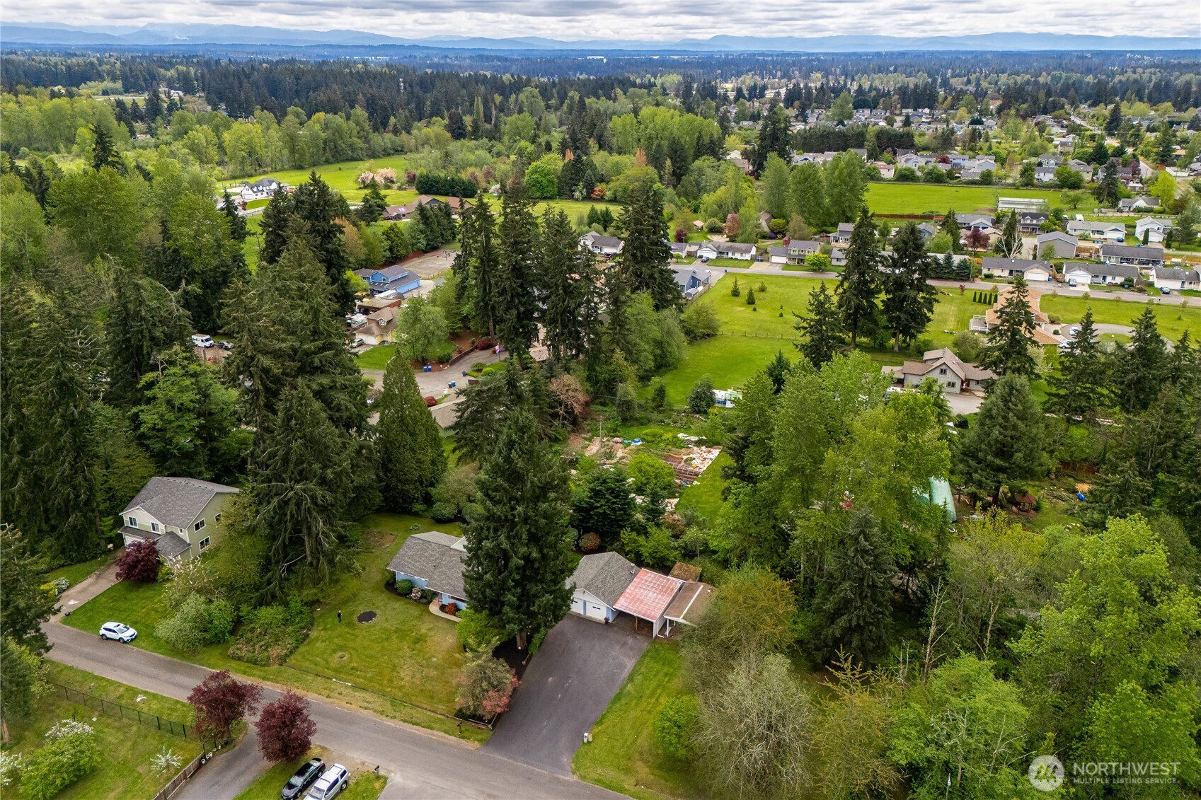 Whether you have dreams of homesteading, growing a vegetable garden or just enjoying the peace & quiet, there's space here to do it all... country living yet close to city amenities! And NO HOA!