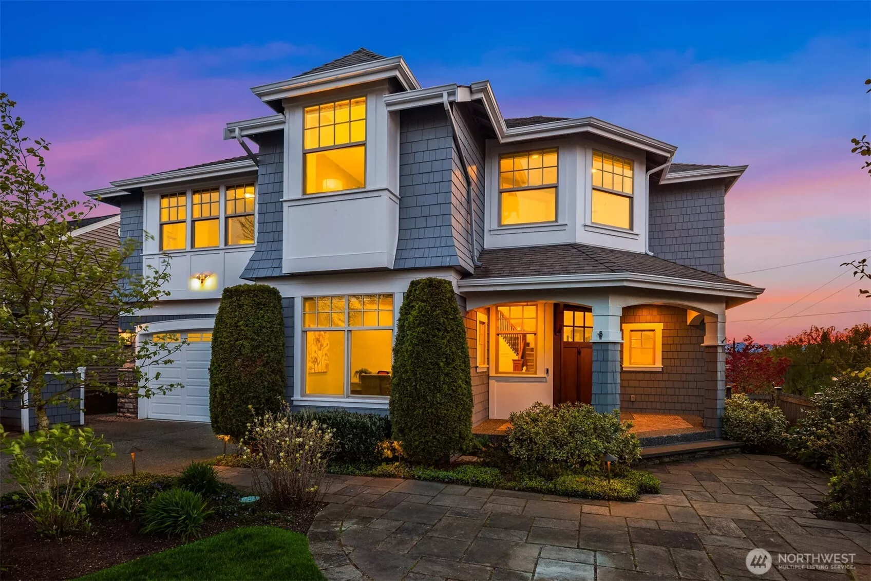 Welcome home to 3255 11th Ave W at twilight on east side of home.