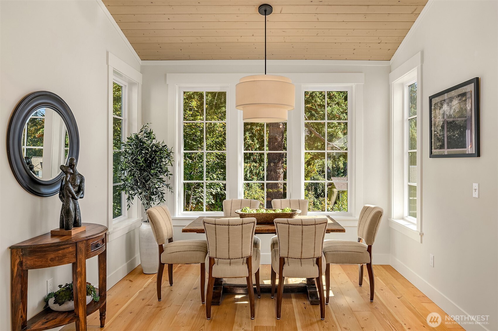 A stunning large dining room space overlooks the woodland and creek beyond.