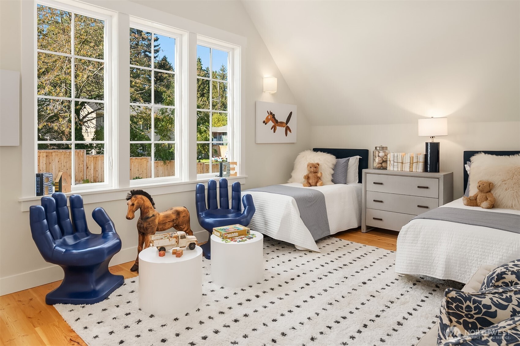 The second of two upstairs vaulted ceiling bedrooms is filled with light from it's westerly exposure.