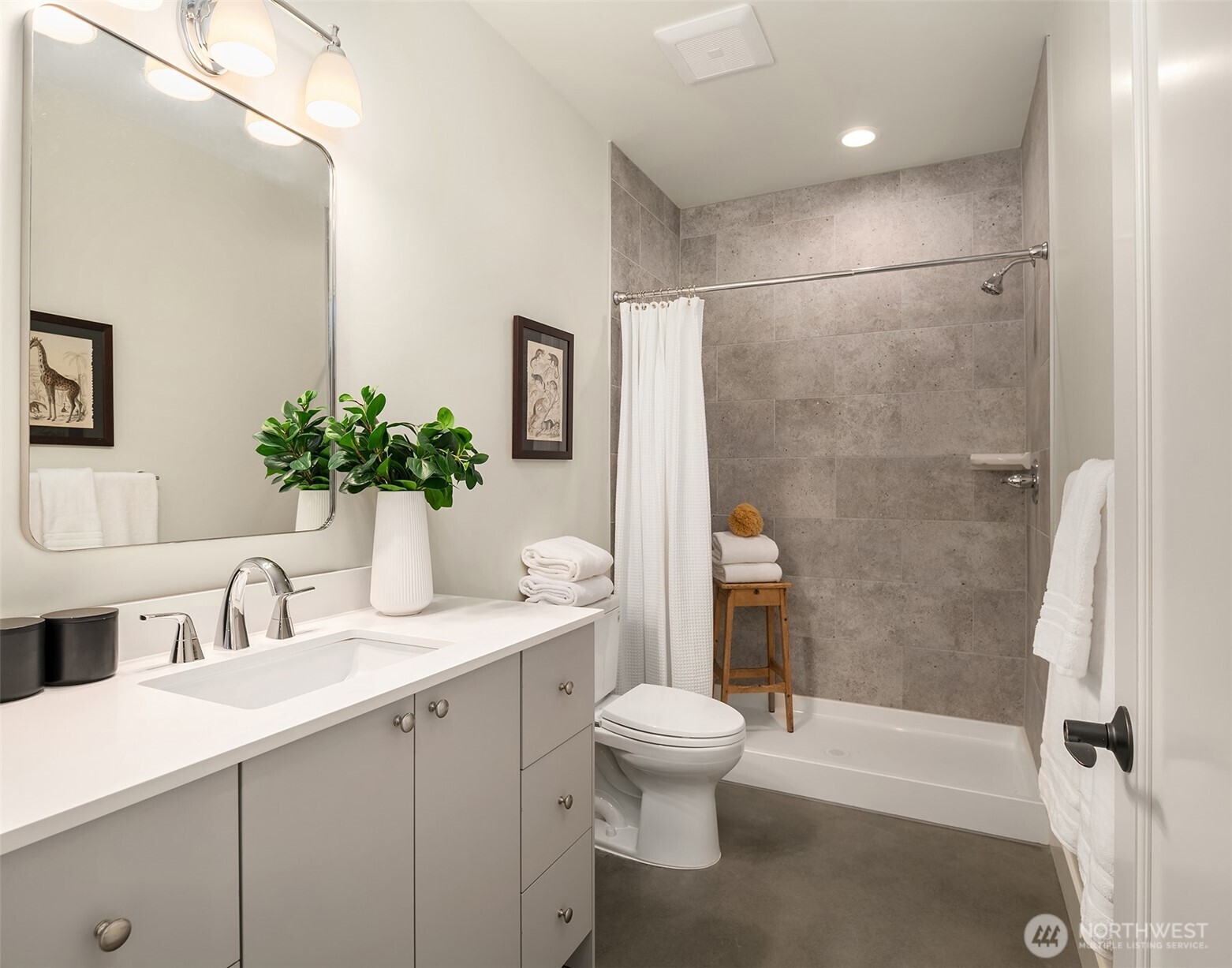 A generous walk in tiled shower is featured in the large lower level bathroom.