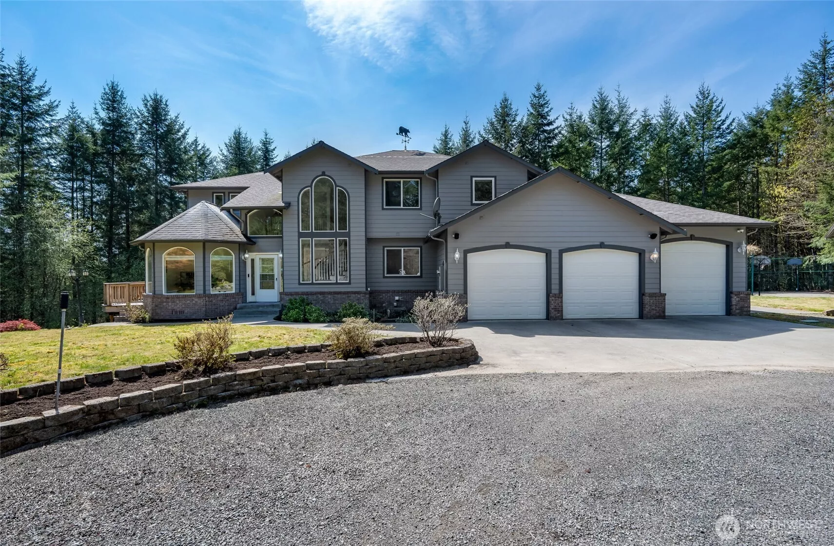 Tucked away in a prestigious gated community, this exquisite custom estate is nestled on over 10 serene, wooded acres—offering unparalleled privacy, tranquility, and room to roam.