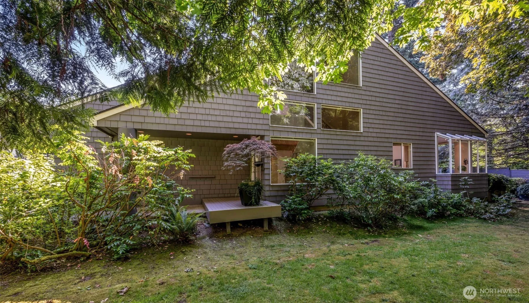Surrounded by deep, wooded greenbelt and wrapped in privacy, the 1985-built, two-story offers timeless style accented by vaulted ceilings and open spaces