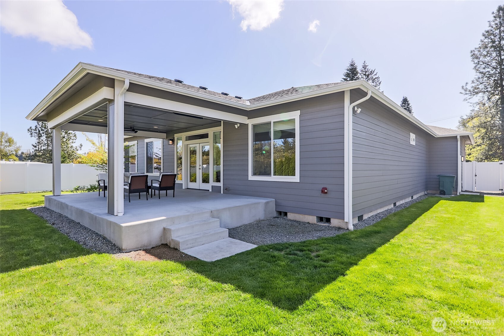 Professionally landscaped, the expansive 9,750 square foot lot features a private fenced backyard perfect for relaxation and outdoor enjoyment.
