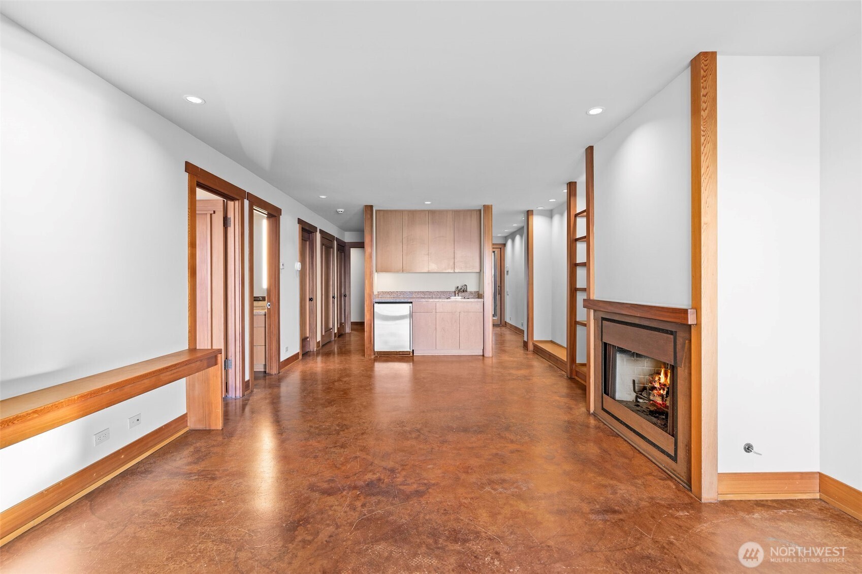 family entertainment area featuring a wet bar and gas fireplace.