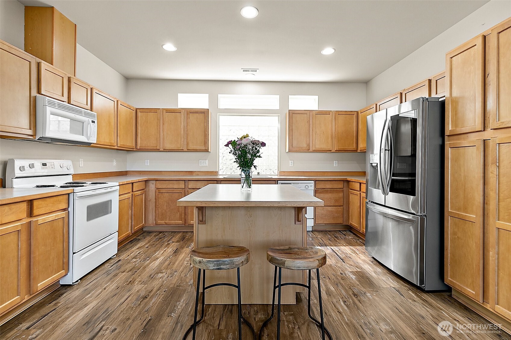 Nice big kitchen with lots of counter and cabinet space! Enjoy your almost brand new fridge!