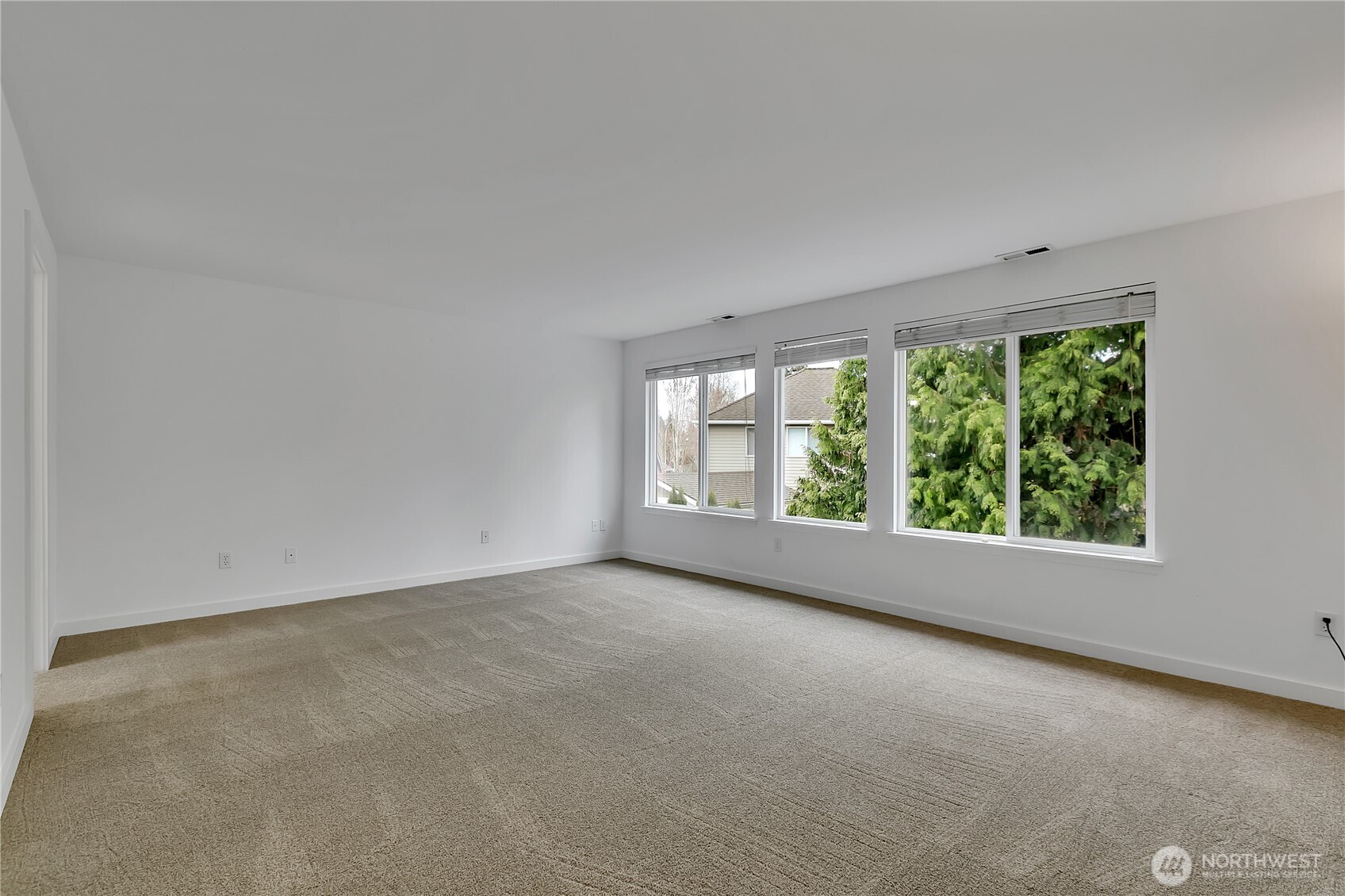 The primary bedroom suite is extremely spacious with lots of natural light.