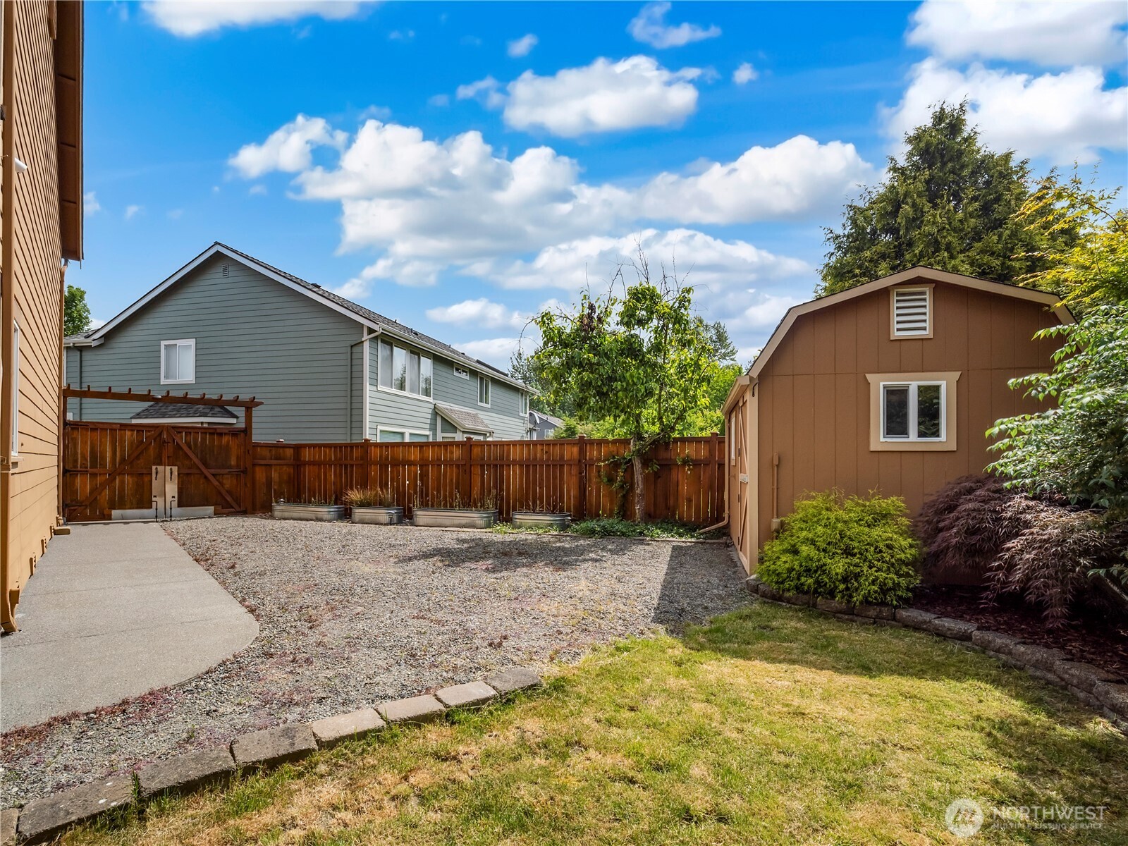 This is the side yard behind the double gate.
