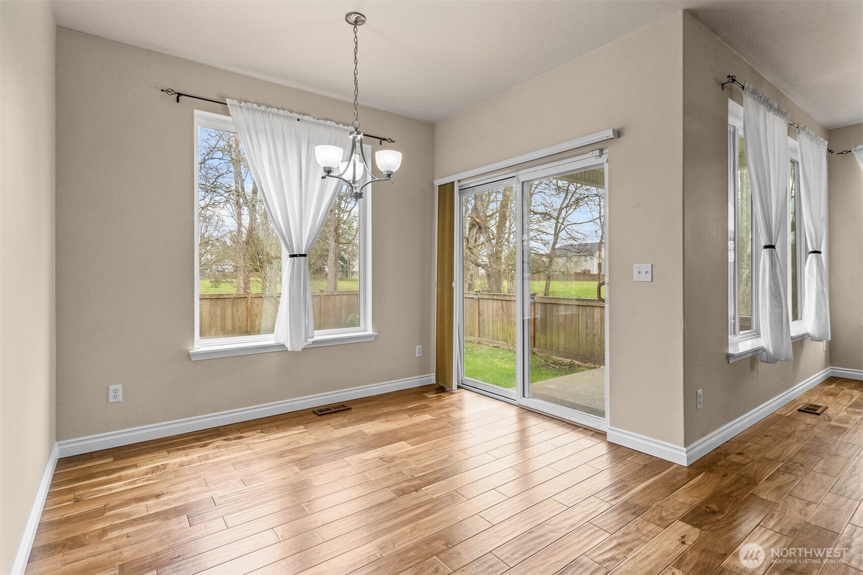 Indoor comfort meets outdoor calm, just beyond the sliding glass door.