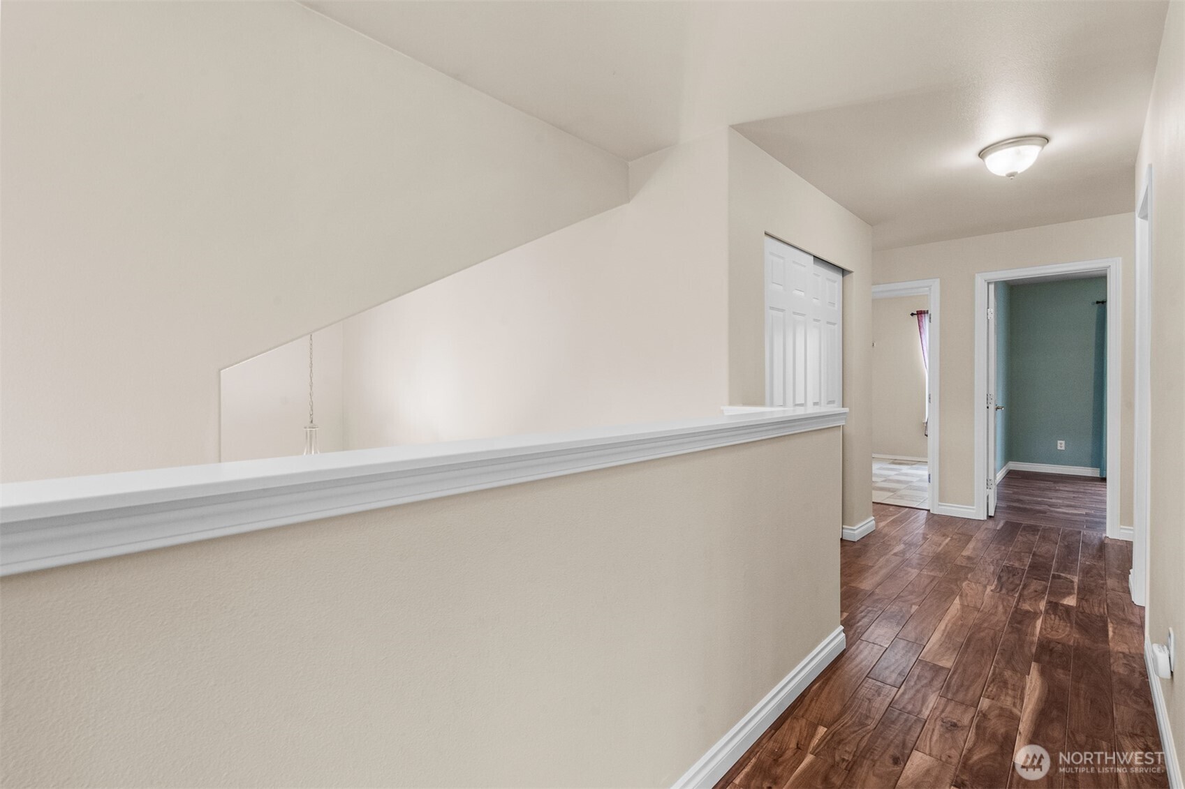 Acacia hardwoods continue through the upper level, creating warmth and seamless flow between bedrooms