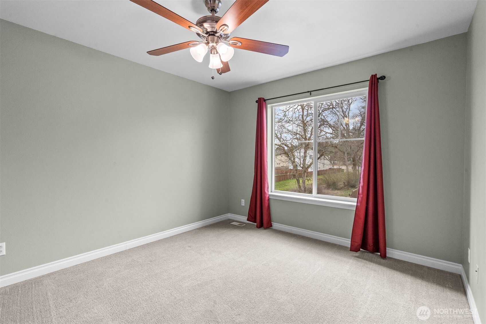 A bright and comfortable third bedroom overlooking the greenbelt
