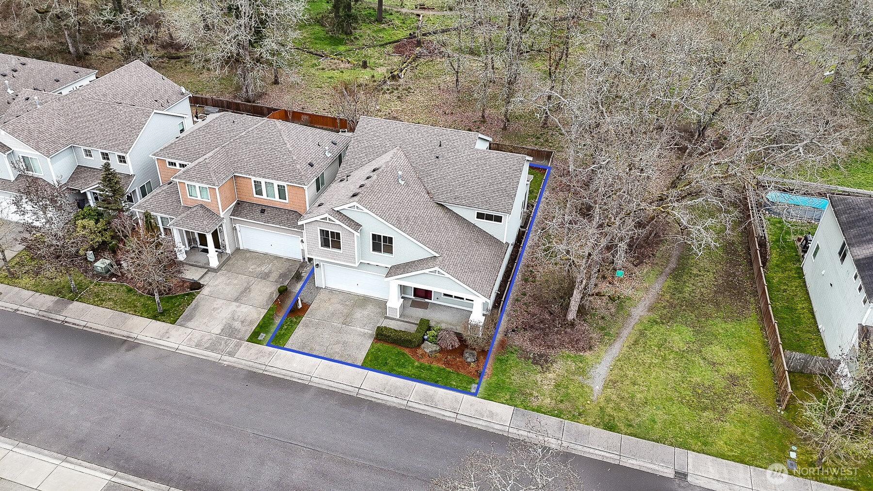 Perfectly positioned on the edge of the neighborhood, backing to natural green space for added privacy and peaceful views