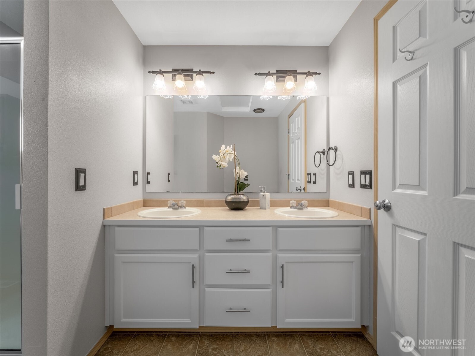 Primary bath includes freshly painted vanity with two sinks and LOADS of storage.