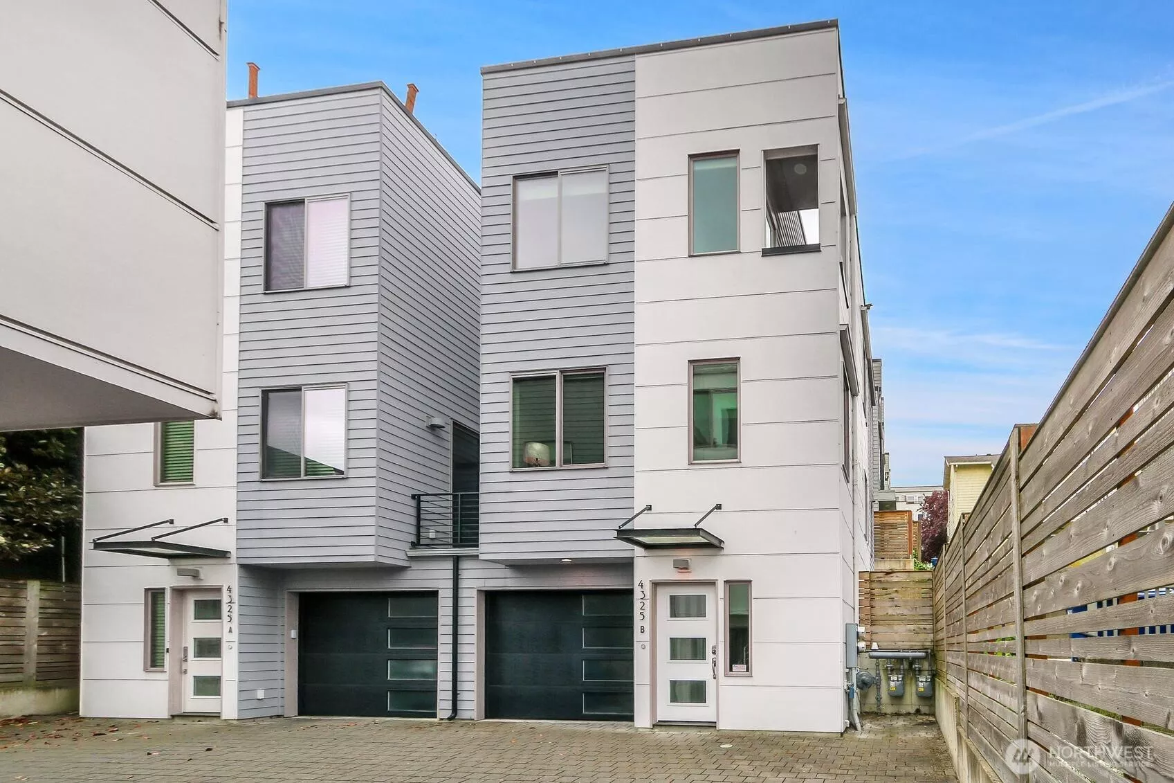 Modern duplex styled townhouse/rowhouse with easy access private garage parking