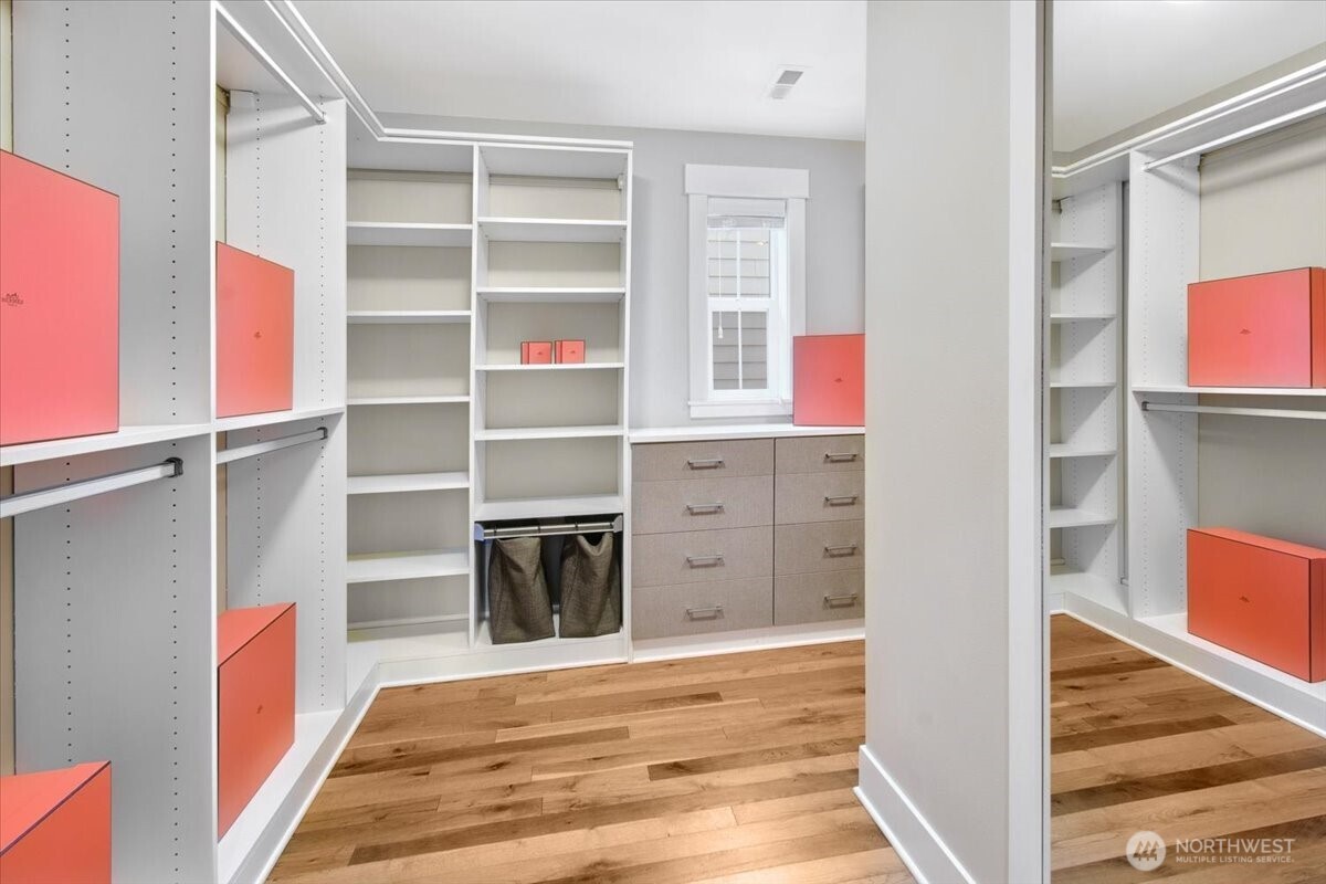 Enormous wrap around walk-in Primary closet
