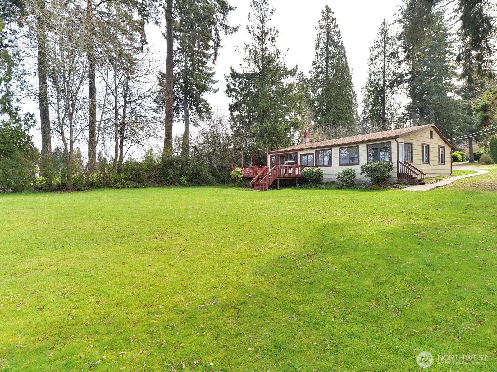 Unique lakefront property, two houses, shop, toolshed, garage.  Over .75 acre