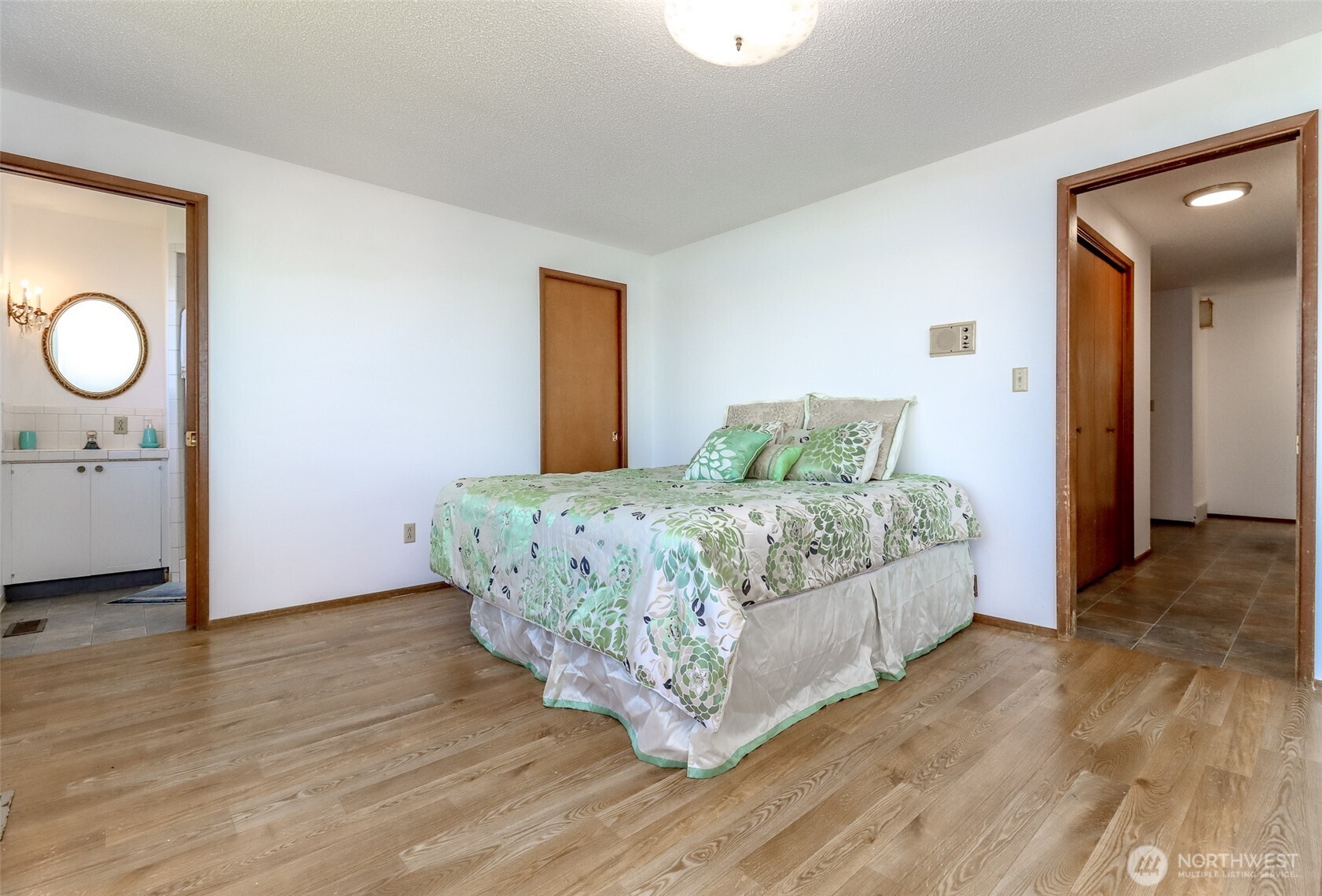 primary bedroom with a .75 bath and walk-in closet